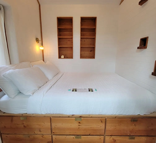 Bedroom with Built In Wood Bookshelves