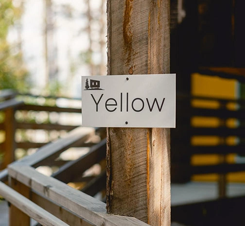 Yellow Cabin Sign and Entrance